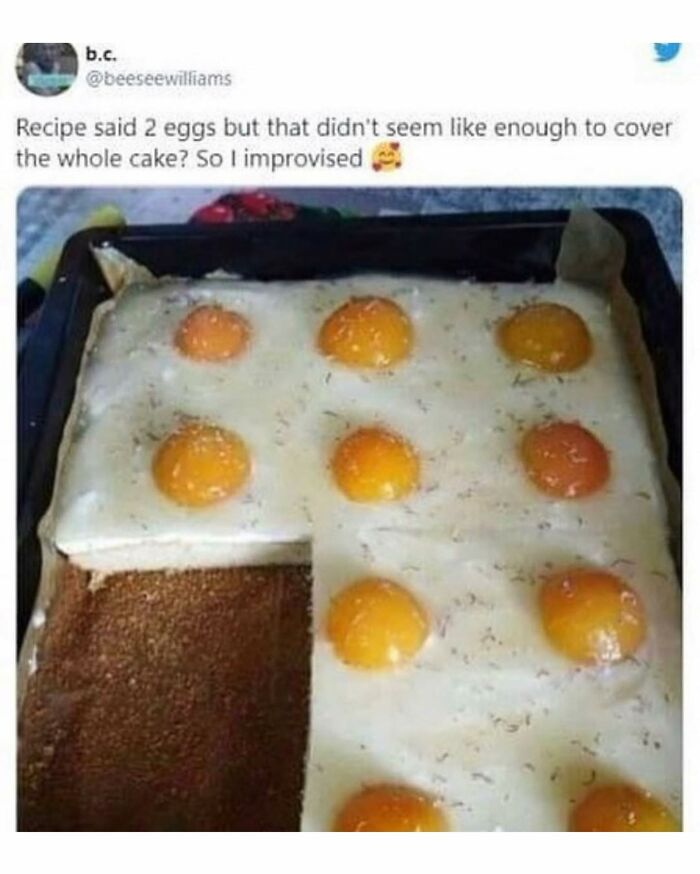 Cake topped with multiple raw egg yolks in a baking tray, a disgusting food pic that might ruin your appetite.