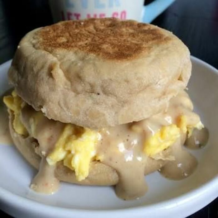 Breakfast sandwich with scrambled eggs and gravy, an unappetizing food pic that might ruin your appetite