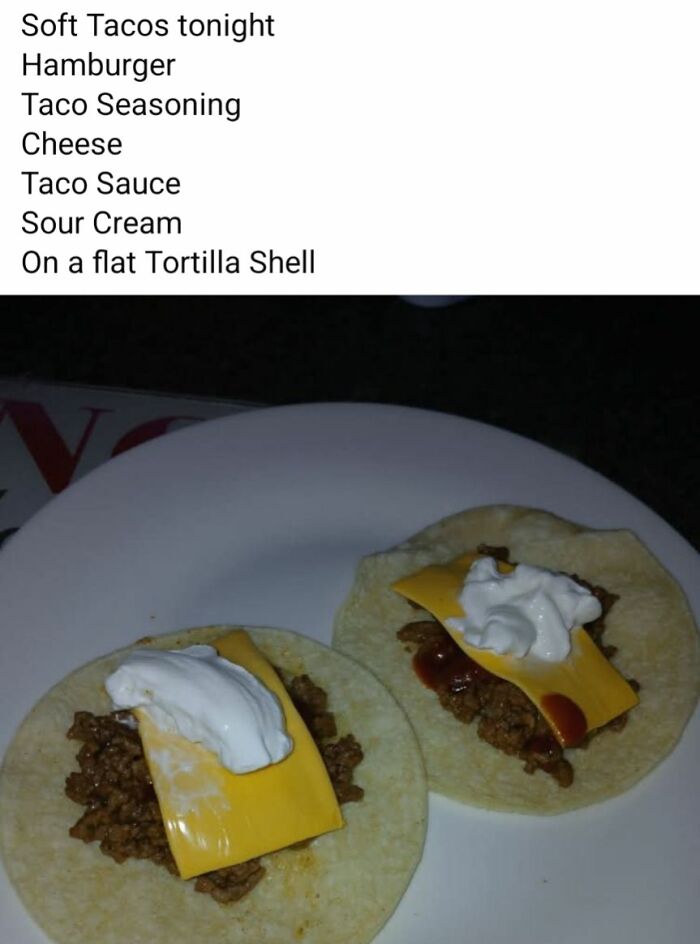 Two flat tortilla shells topped with hamburger meat, processed cheese slices, sour cream, and taco sauce in a disgusting food pics collection.