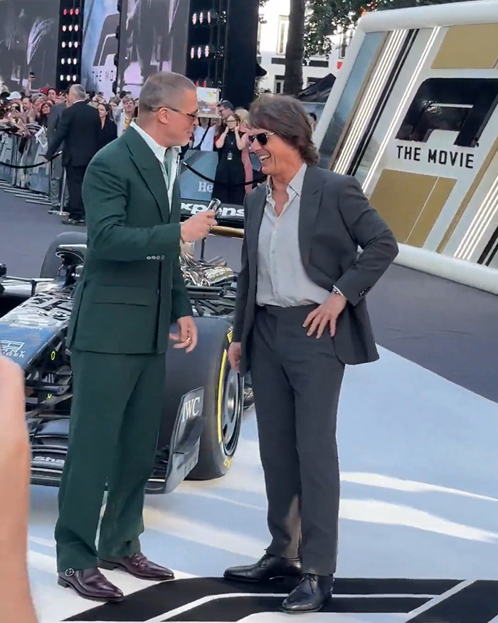 Tom Cruise and Brad Pitt talking and smiling at the F1 premiere, sparking Botox rumors and media attention.