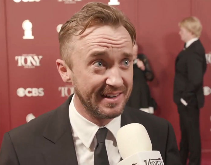Tom Felton speaking on the red carpet causing Harry Potter fans to react strongly to J.K. Rowling comments.