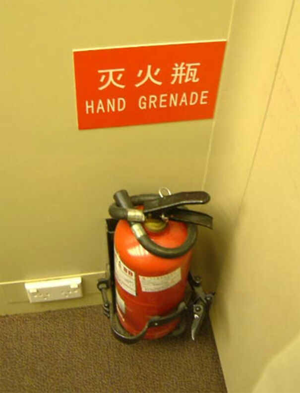 Fire extinguisher labeled as hand g*****e in a funny and baffling English translation attempt on a red sign.
