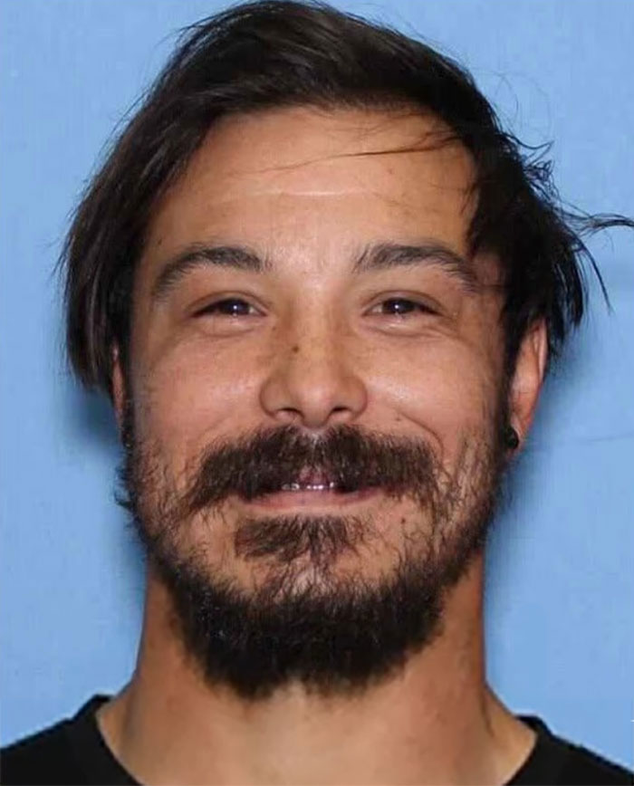 Man with dark hair and beard pictured in a close-up headshot related to blood not belonging to a human found at crime scene.