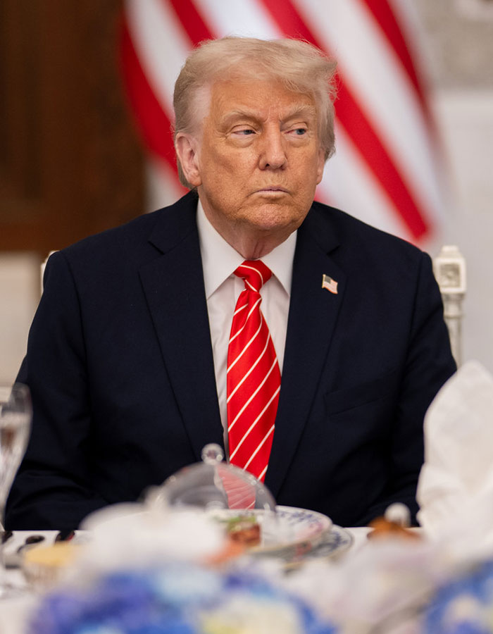 Former president at a formal event, highlighting Elon Musk&rsquo;s feud with the president and interest in his sister&rsquo;s romance service.