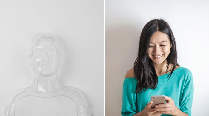 Young woman smiling while using her phone, participating in a truth or dare poll in a casual setting.