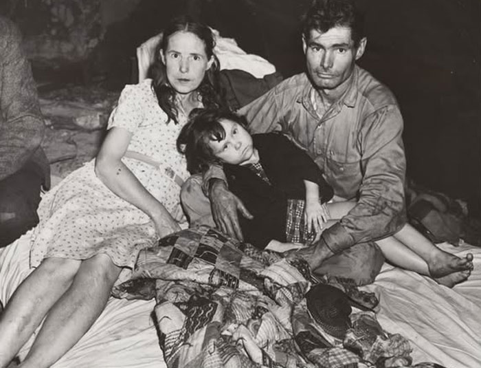 Rare historical photo of a family resting together, capturing a poignant moment from the past.