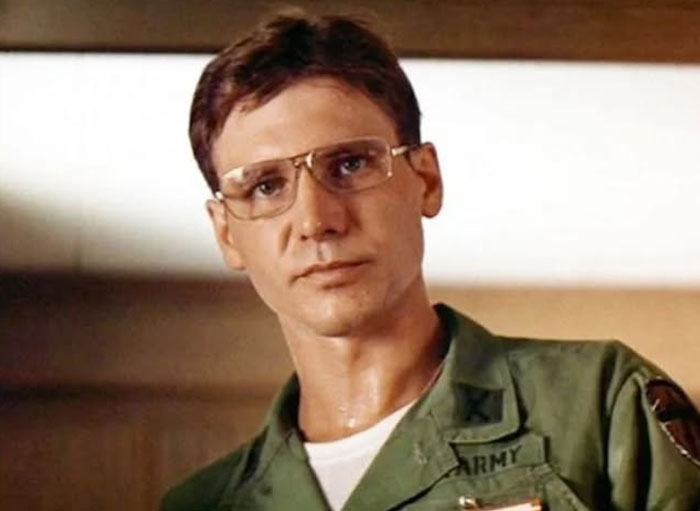 Man in vintage army uniform and glasses, captured in rare historical photo representing moments most of us weren’t alive to see