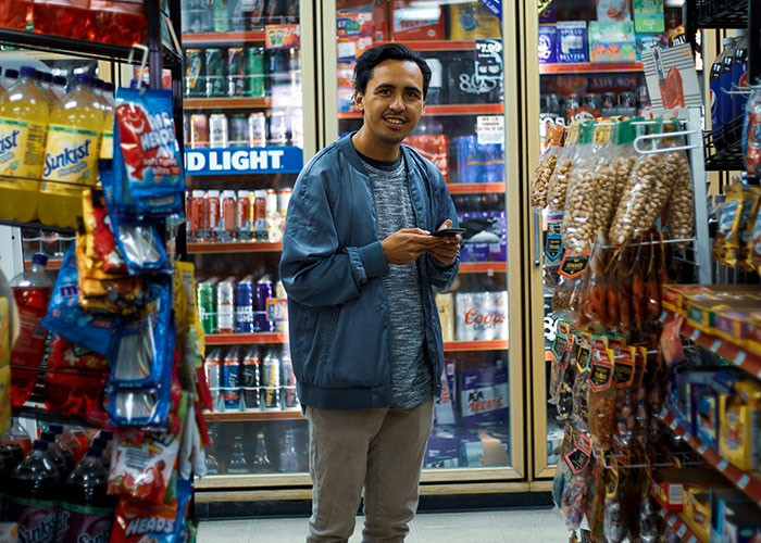 Man in a convenience store aisle surrounded by snacks and drinks, a scene from weirdest and scariest security tape footage
