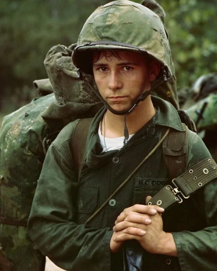 Young soldier in vintage military gear, showing a rare and weird aspect of history in a forest setting.