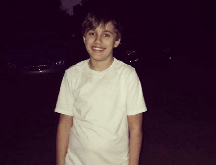 Teen boy smiling outdoors at night wearing a white t-shirt, related to 16 And Pregnant star Whitney Purvis news.