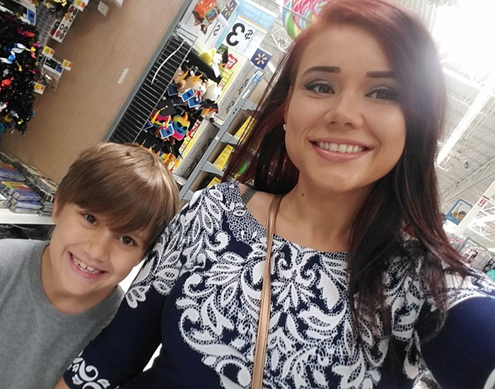Whitney Purvis smiling with a young boy in a store aisle, related to 16 And Pregnant star news.