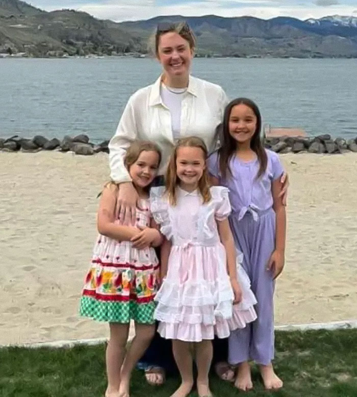 Woman posing with three young girls by the lakeside, related to blood not belonging to a human found at tragic crime scene.