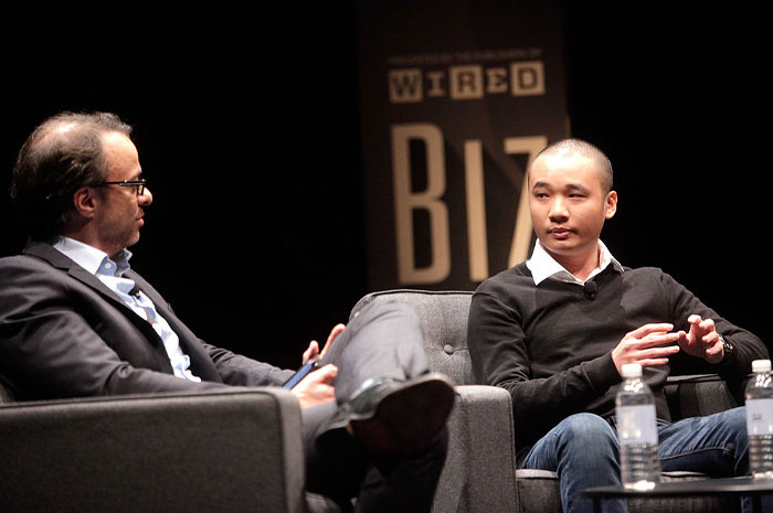 Two men including Dong Nguyen in a discussion at a Wired Biz event, with focus on Flappy Bird&rsquo;s ban and 2025 revival in gaming.