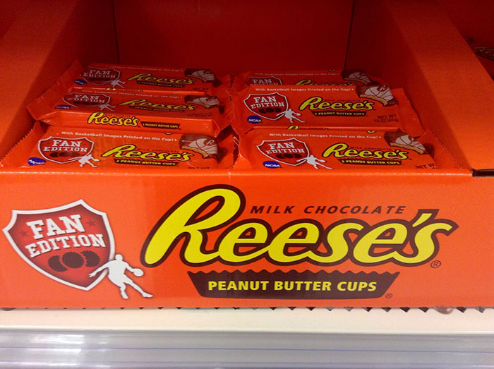 Display of Reese's peanut butter cups with fan edition packaging, an example of product design flaws causing customer frustration.