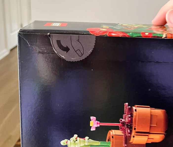 Packaging with design flaws showing a broken seal on a product box that frustrates users every time.