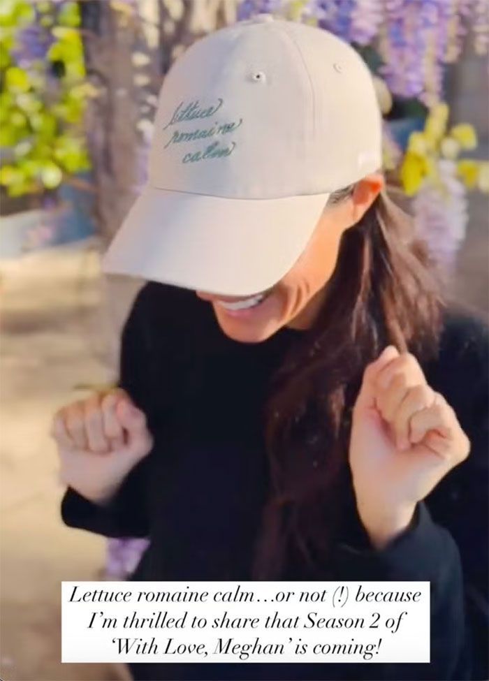 Meghan Markle smiling outdoors wearing a white cap, linked to Meghan Markle hitchen hack and public reaction.