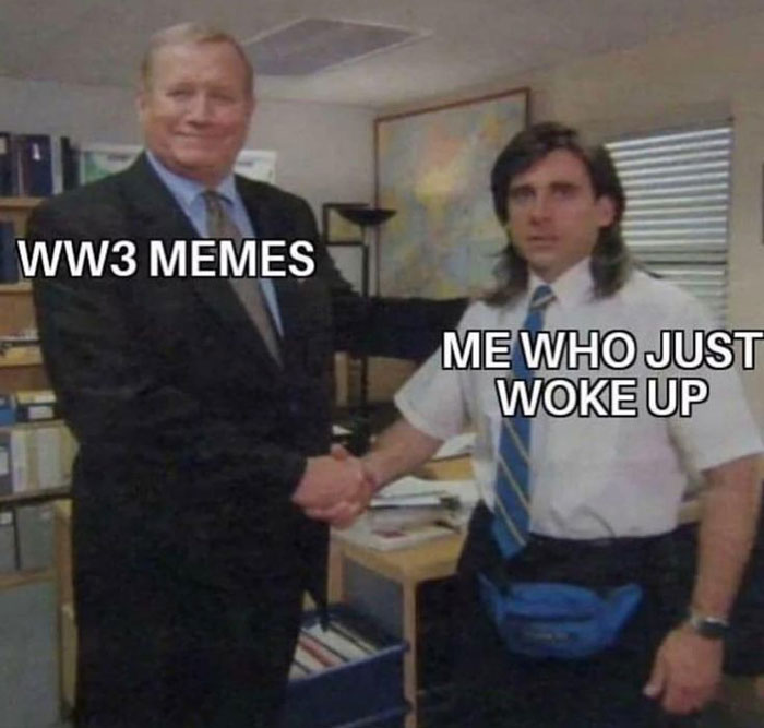 Two men shaking hands in an office setting with text overlay referencing WW3 memes and waking up.