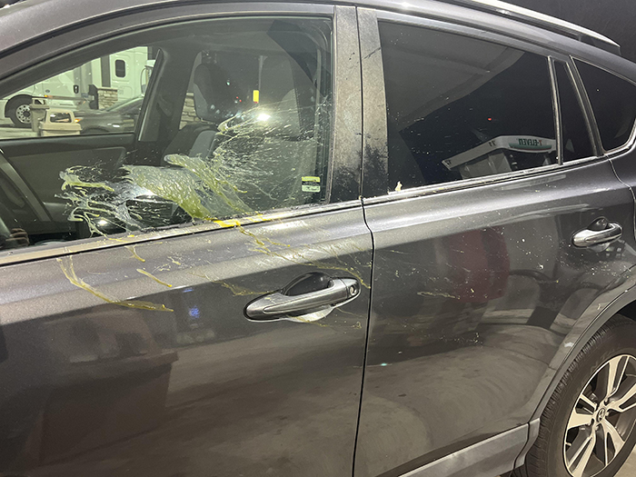 Black car door splattered with yellow paint in a prank, related to family stages fake legal notice on a woman. Black car door splattered with yellow paint in a prank, related to family stages fake legal notice on a woman.