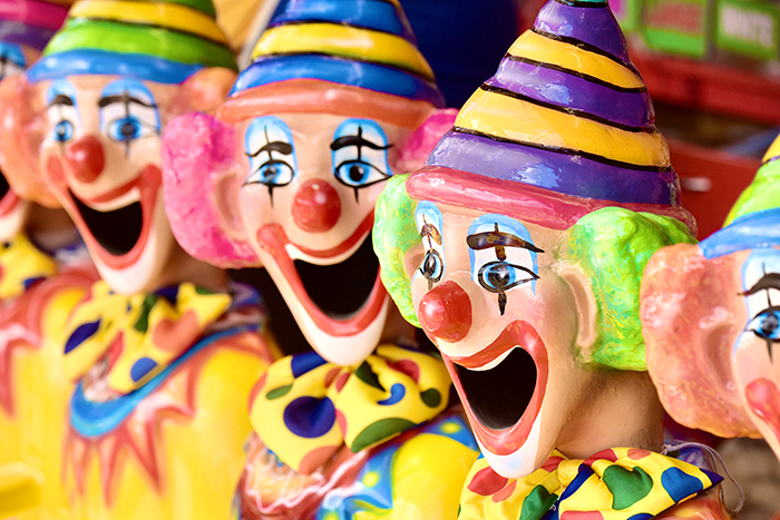 Colorful huge clown collection with multiple smiling clown figures wearing striped hats and polka dot bow ties. Colorful huge clown collection with multiple smiling clown figures wearing striped hats and polka dot bow ties.