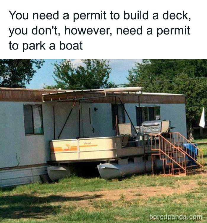 Trailer deck supported by boat pontoons, showcasing creative redneck engineering and inventive MacGyvering solutions outdoors.