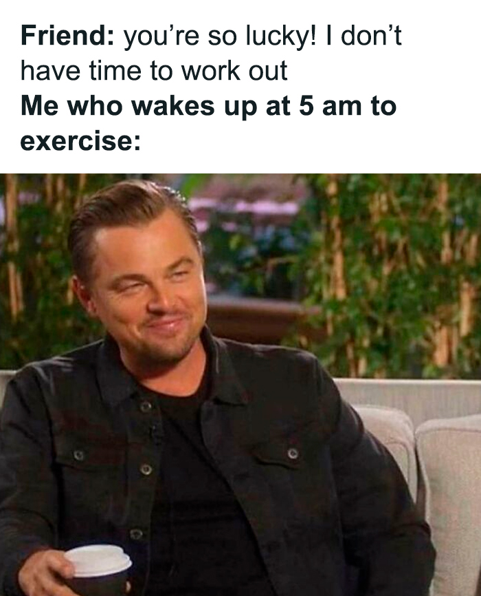 Man smirking while holding coffee cup, illustrating gym humor for those who spend half their life at the gym.