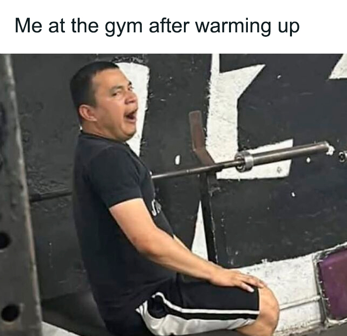 Man at the gym looking tired and yawning after warming up in a humorous gym memes image for gym lovers.