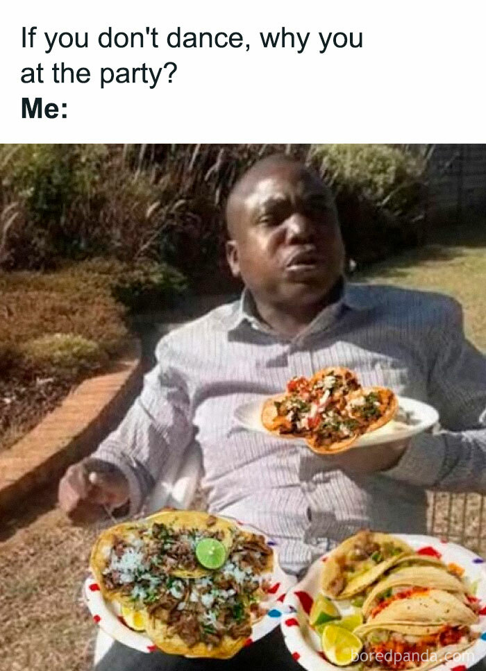 Man at outdoor party holding plates of tacos, humorously illustrating funny Hispanic memes about party dancing and food.