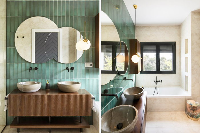 Modern living space revamp featuring green tiled walls, round mirrors, vessel sinks, and a minimalist bathtub design.
