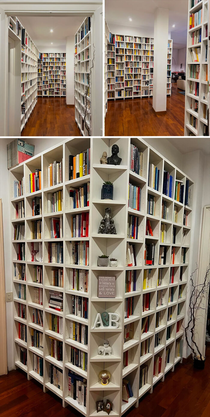Spacious living space revamp featuring custom white bookshelves filled with books and decorative items on wooden floors.