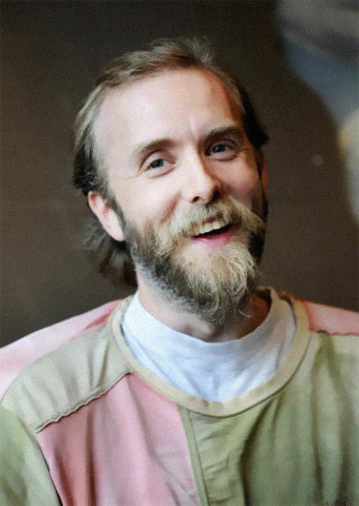 Smiling man with a beard wearing a muted color shirt, featured in photos with terrifying and horrific backstories. - 45