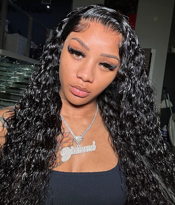 Young woman with long curly hair and a silver necklace, linked to former reality TV child star incident at Walmart. - 1