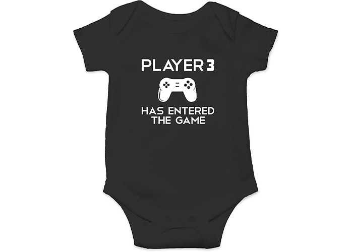 Black baby onesie with a game controller graphic and text about player 3 entering the game, referencing video games and pregnancy. Black baby onesie with a game controller graphic and text about player 3 entering the game, referencing video games and pregnancy.