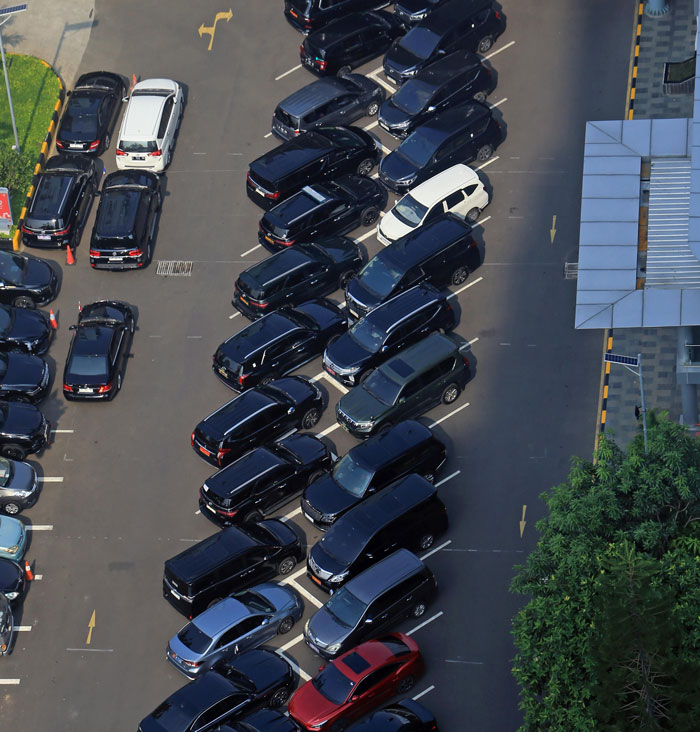 Aerial view of a crowded parking lot with cars parked in unusual, disorganized positions showing unexplainable real-life horror. - 26