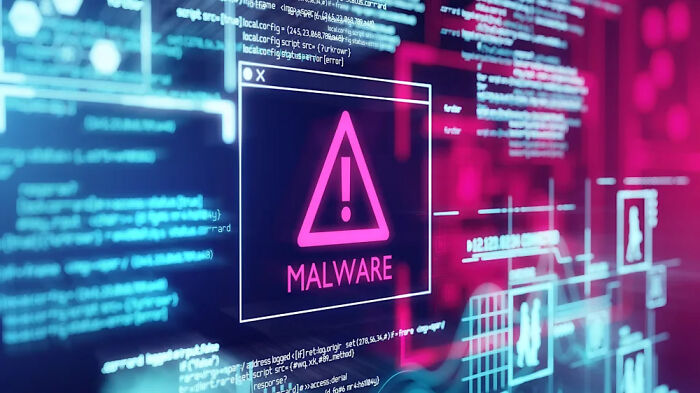 Computer screen showing malware warning and code, illustrating consequences of stupidity leading to job loss risks.