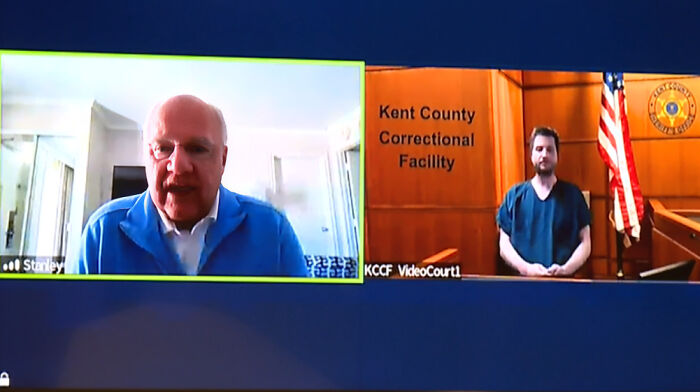Courtroom video call showing a man in a correctional facility facing the consequences of his own actions and lost his job.