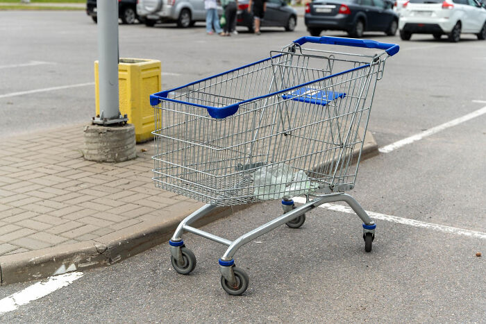 Shopping cart abandoned in a parking lot, illustrating normal people's habits some netizens find really creepy. - 2