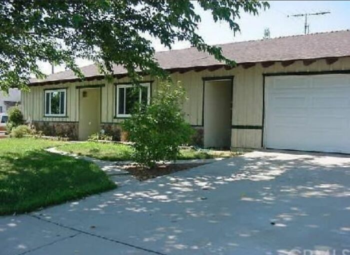 Suburban home with an unusual split entrance and garage design showing creative home design fail.