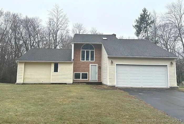 Modern suburban house with awkward window placements showing creative home design fails in a quiet neighborhood.