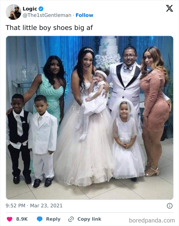 Group photo at a wedding showing grooms and family, highlighting moments of grooms’ sense of entitlement in a joyful setting.