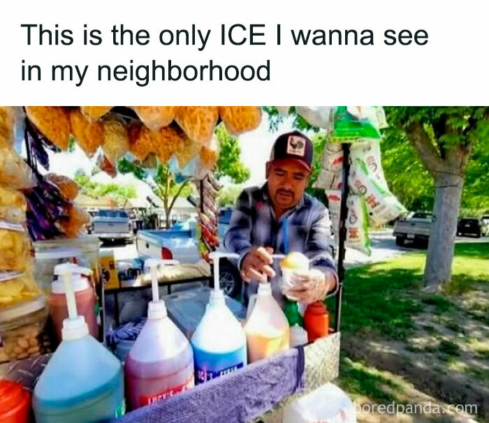 Hispanic man serving flavored ice with various syrup bottles at outdoor neighborhood food stand, capturing Hispanic culture humor.
