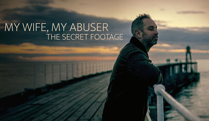 Man reflecting by pier at sunset, representing a landmark domestic violence case involving scalding and hospitalization.