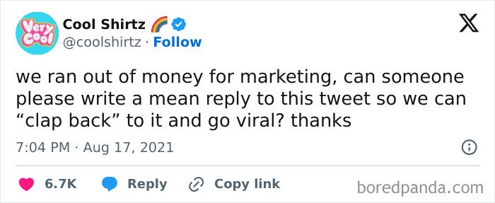 Funny tweet from official social media account asking for a mean reply to boost marketing and go viral online.
