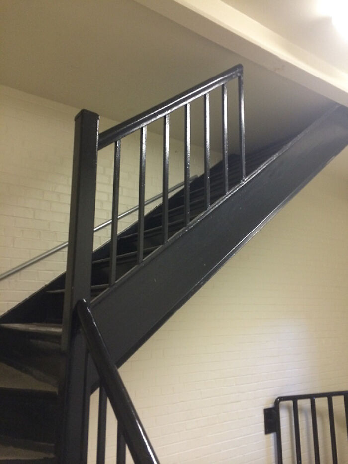 Black metal staircase inside a home showing a creative but flawed design in interior home creativity.