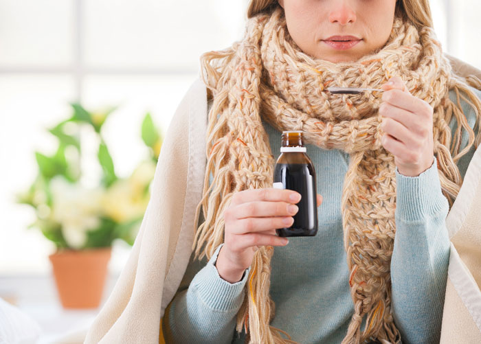 Teen wrapped in scarf taking cough syrup, showing frustration with frequent hospital visits and mom’s false claims. - 10