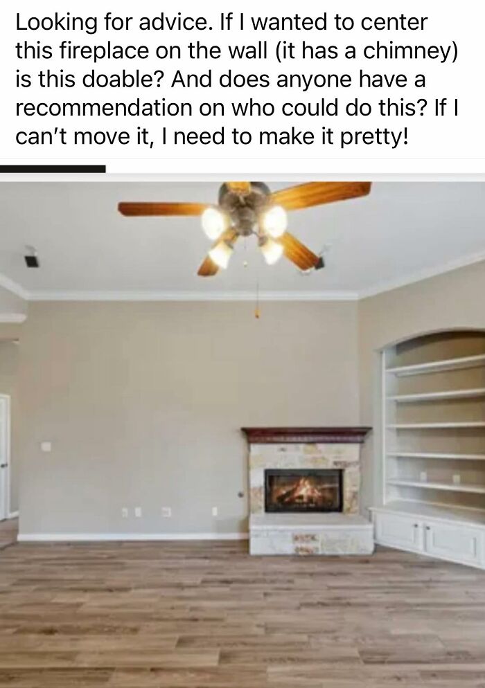 Living room with off-centered stone fireplace, wooden ceiling fan, and built-in shelves, showing creative home design challenge.