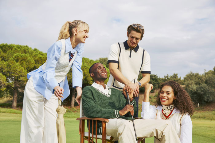 Group of wealthy people enjoying golf outdoors, showcasing unexpected things people learned about the rich through interaction