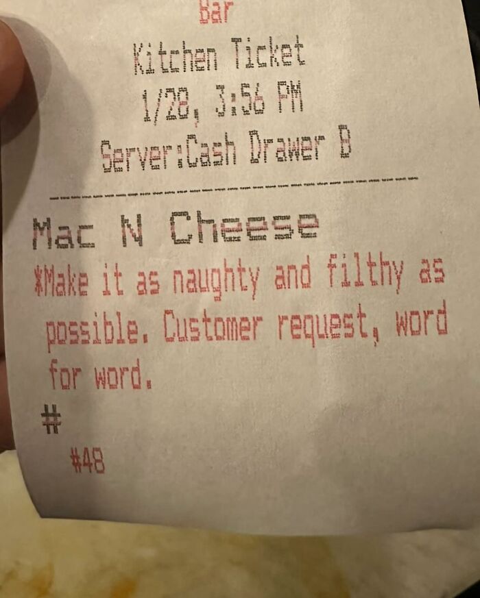 Kitchen ticket showing a humorous customer request to make mac and cheese as naughty and filthy as possible.