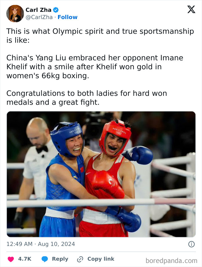 Two female boxers embracing in the ring showcasing the beauty of Planet Earth through sportsmanship and unity.