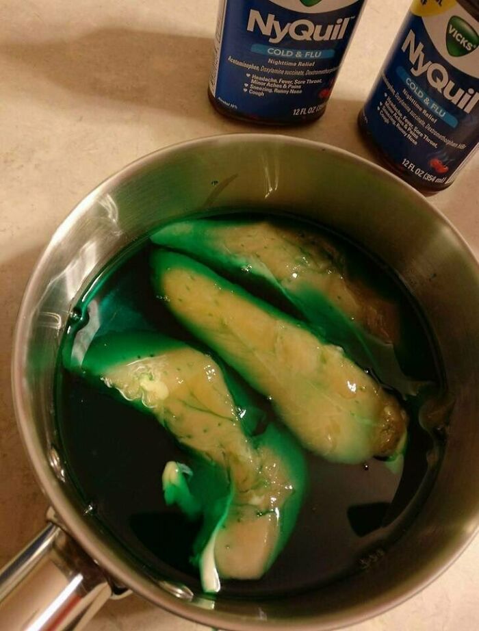 Green liquid and peeled bananas in a pot with NyQuil bottles, illustrating dangerous TikTok challenges and their risks.