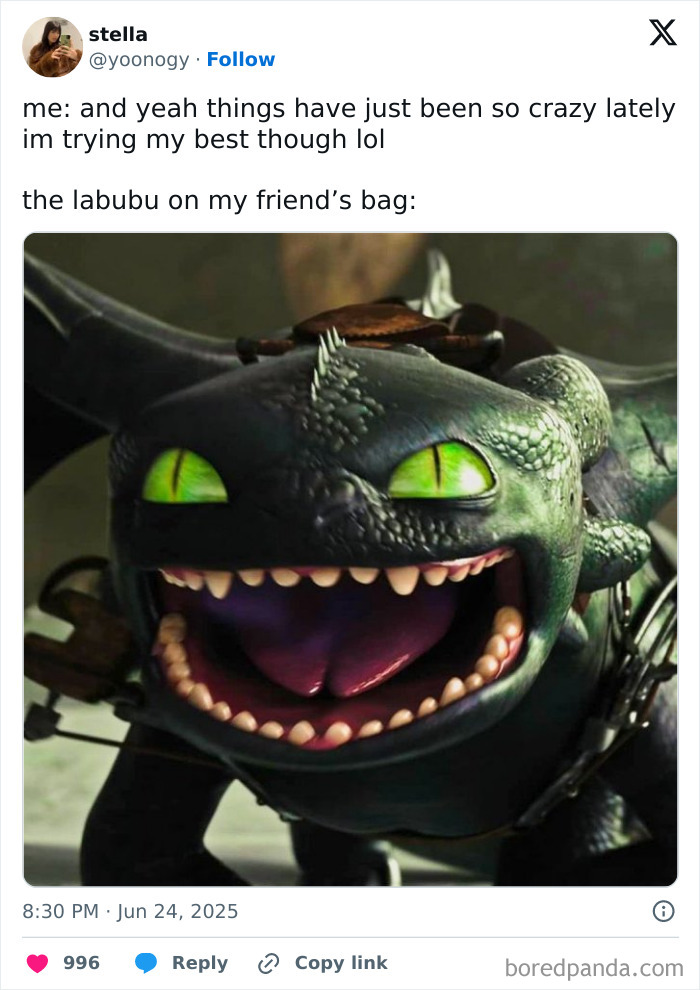 Close-up of a Labubu doll with bright green eyes and a wide grin, featured in popular online memes.